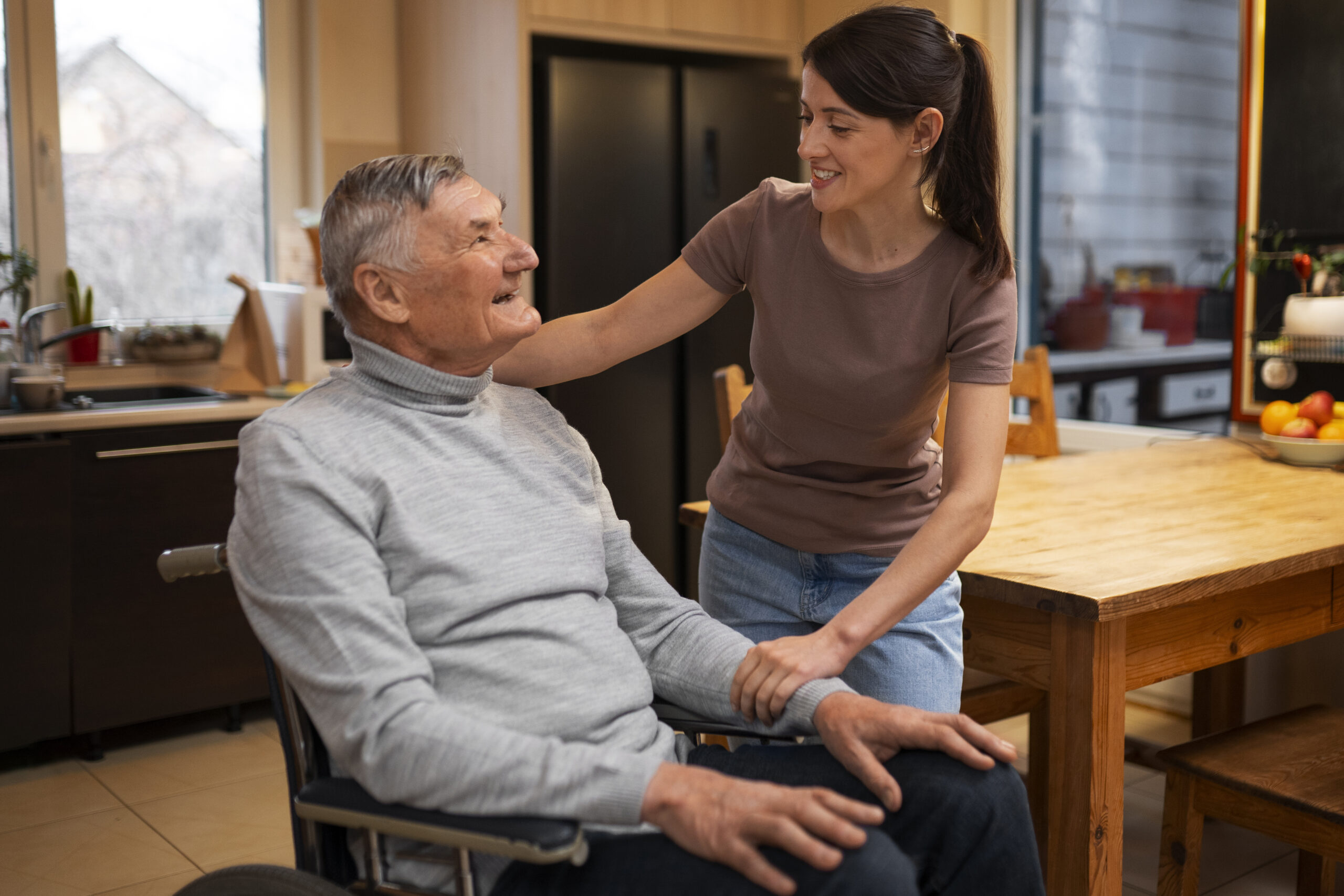 elderly-person-being-taken-care-by-female-caretaker-scaled.jpg